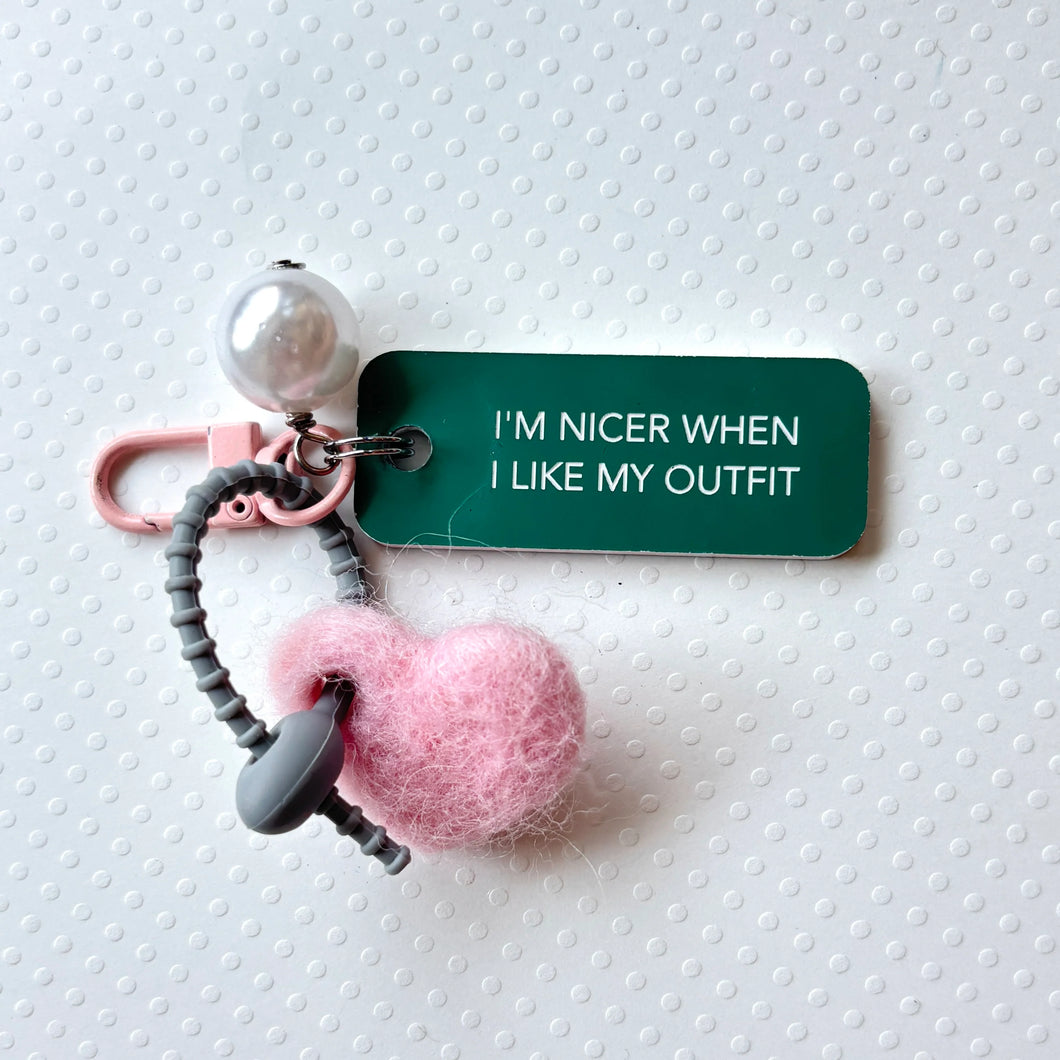 I'M NICER WHEN I LIKE MY OUTFIT Bag Charm by Kommentarie